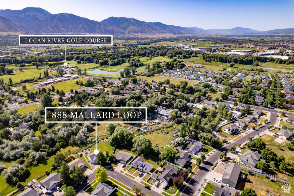 Aerial perspective of suburban area featuring a water and mountain view