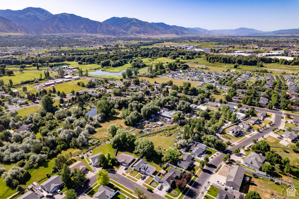 Aerial perspective of suburban area featuring a water and mountain view