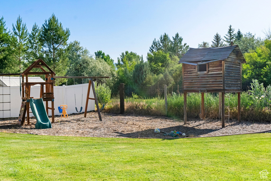 View of play area with a lawn