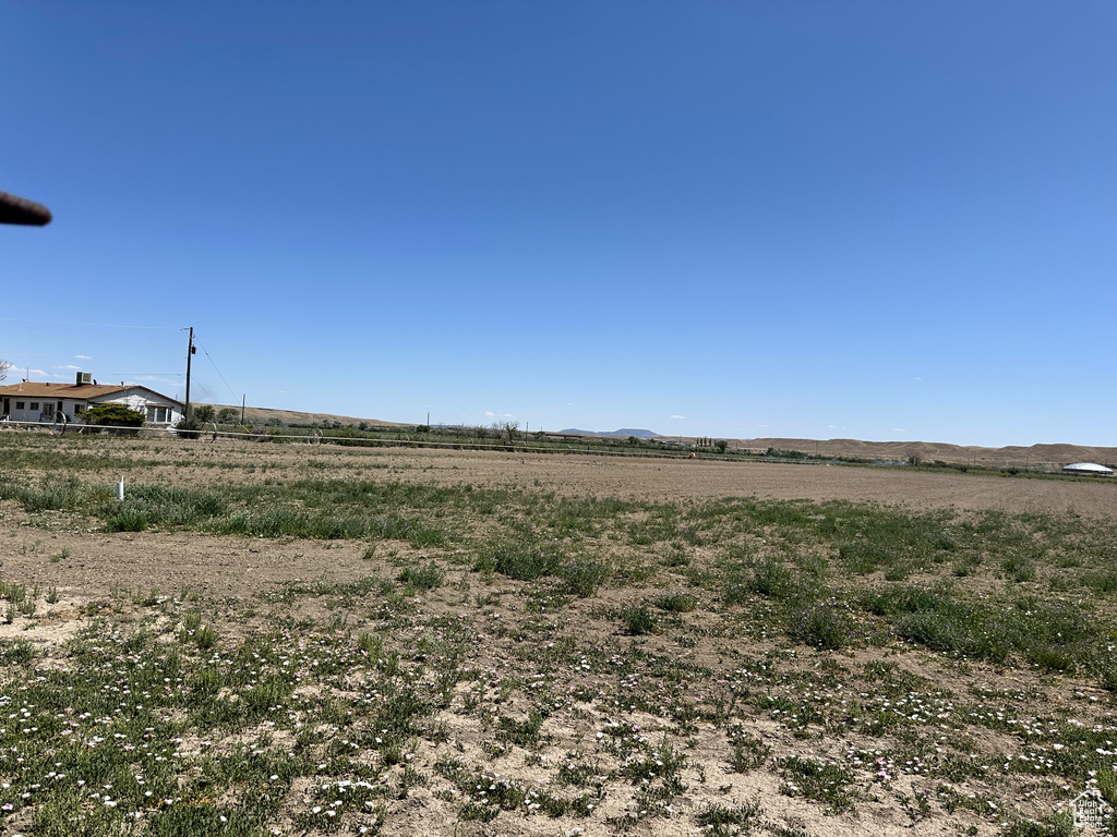 View of yard with a rural view