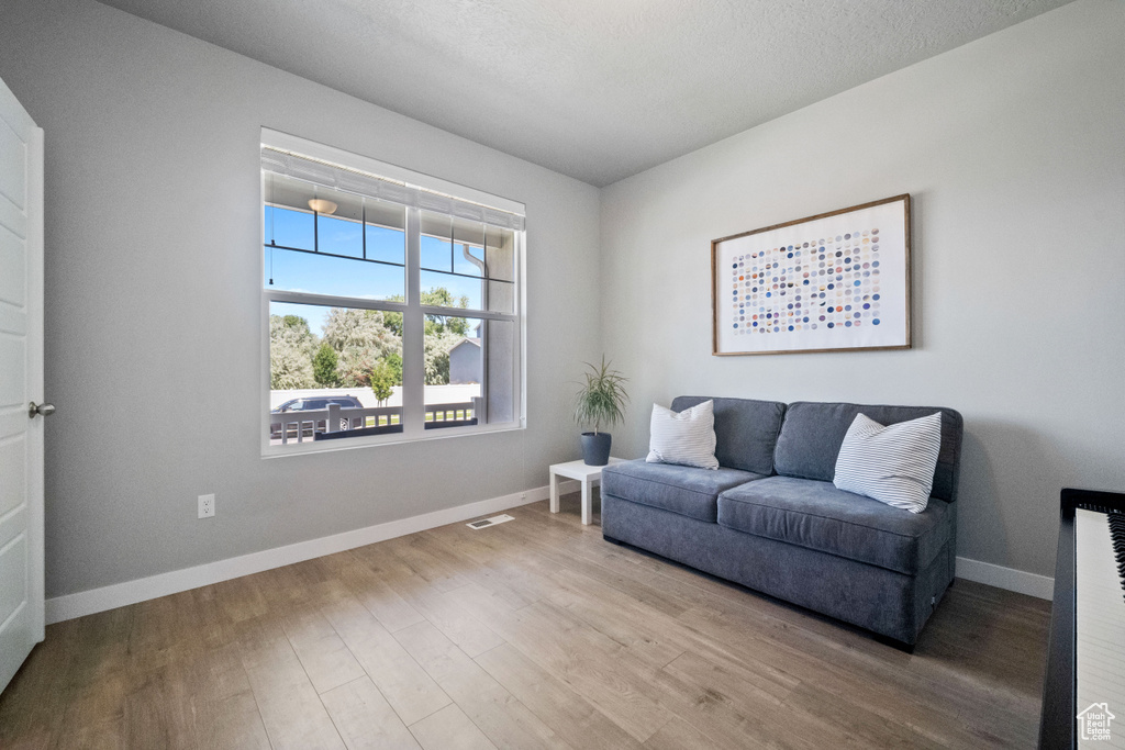 Sitting room with wood finished floors