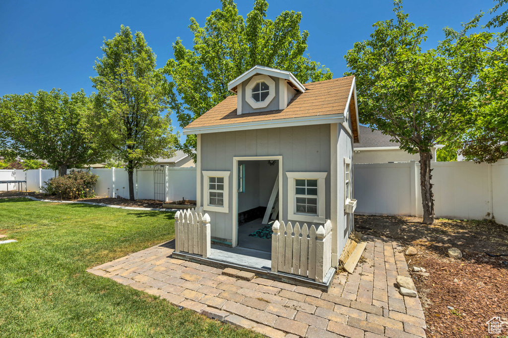 View of outdoor structure with a fenced backyard