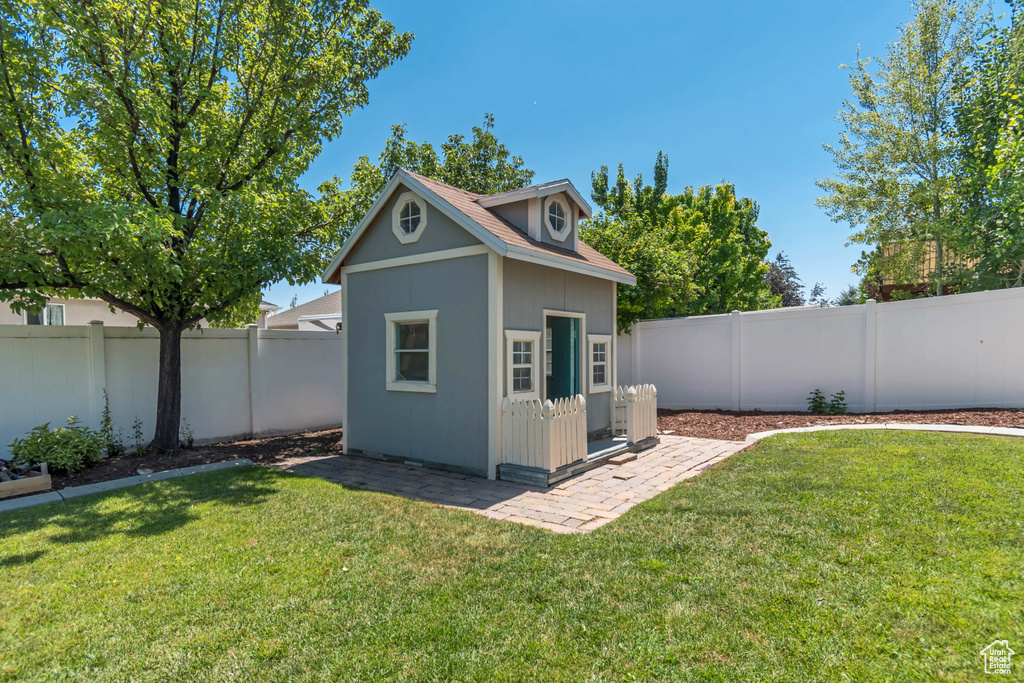 View of outdoor structure with a fenced backyard