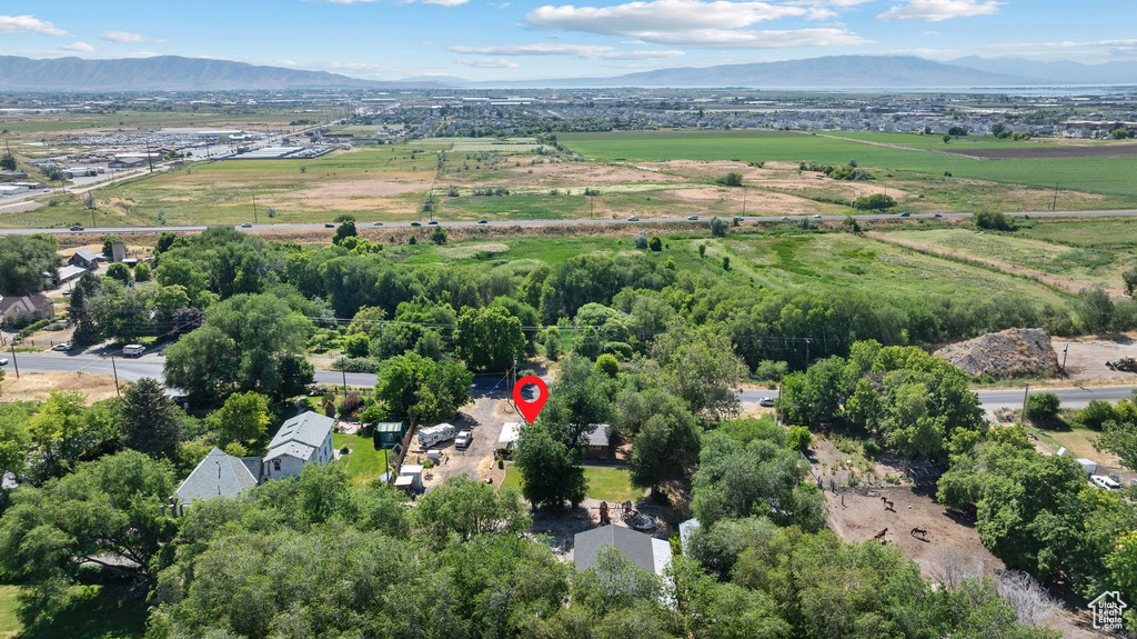 Aerial view of property\'s location with a mountainous background