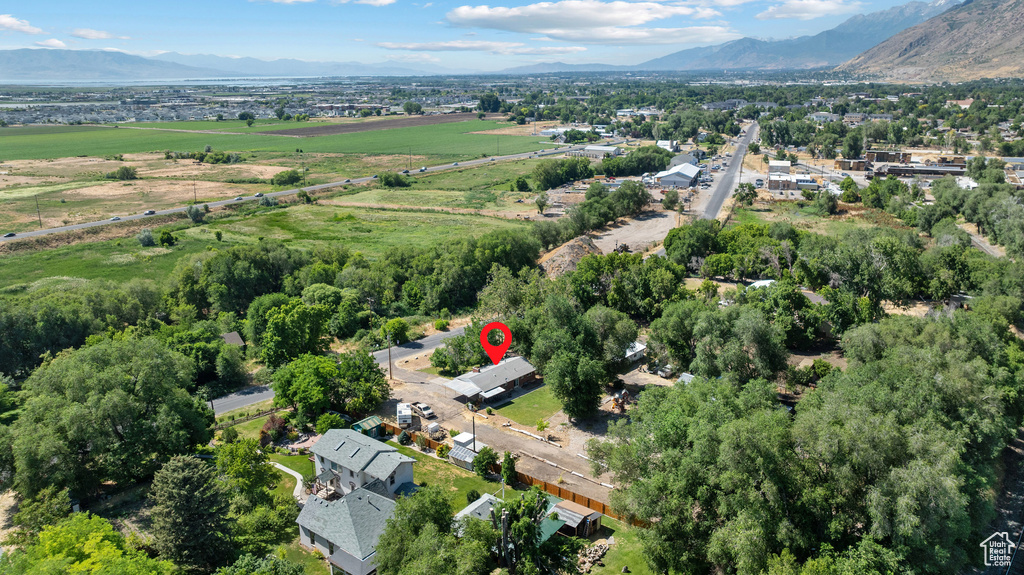 Aerial overview of property\'s location with a mountainous background