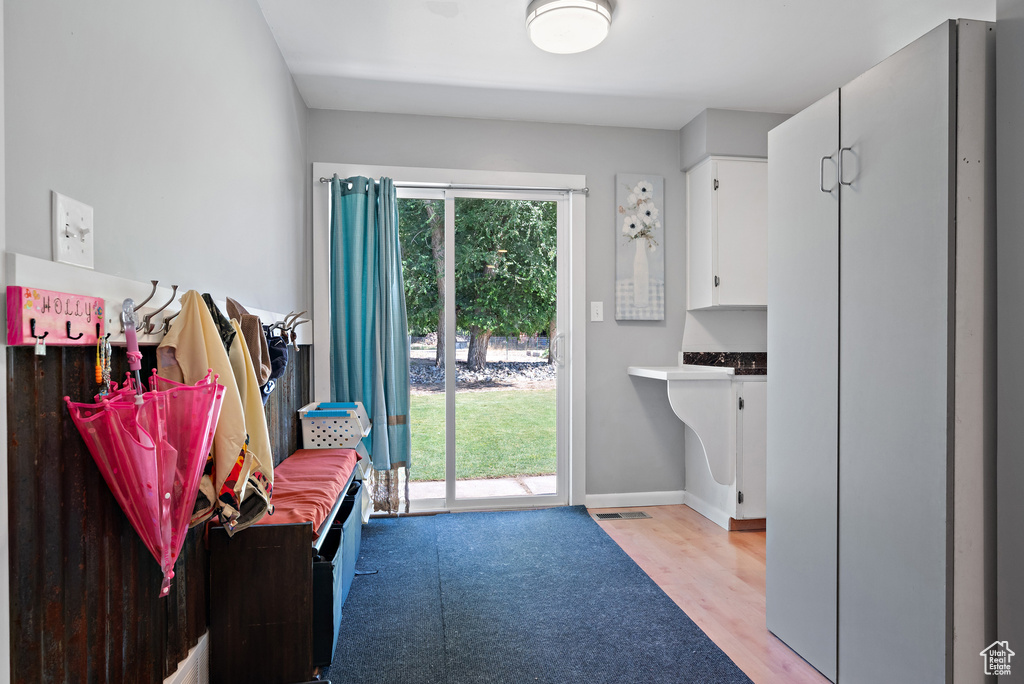 Interior space with light wood-type flooring and baseboards