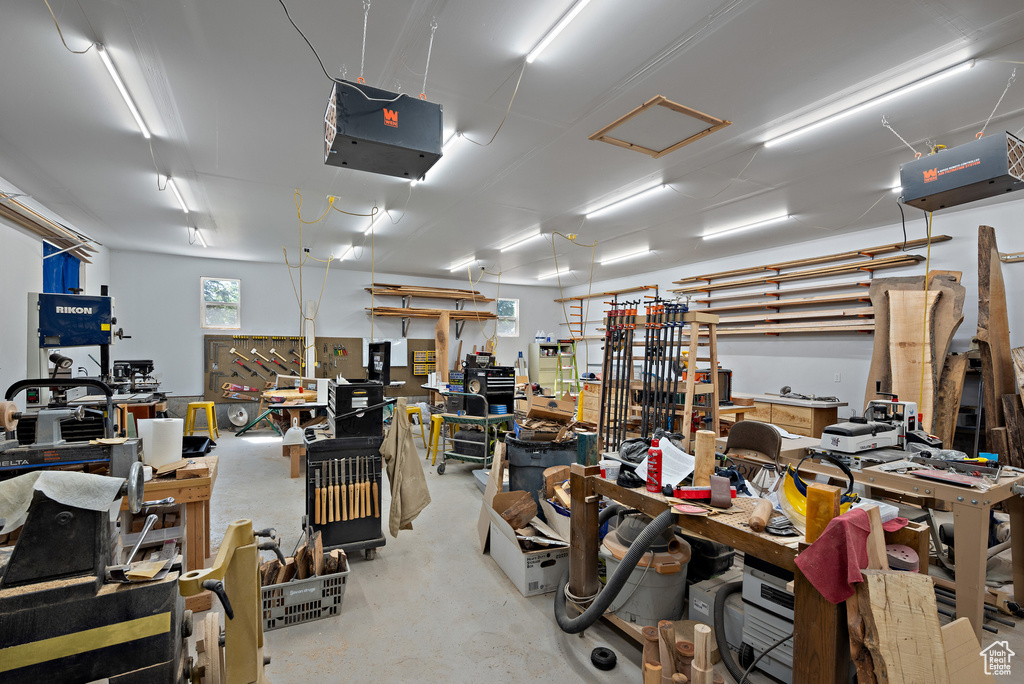Garage with a workshop area and a garage door opener