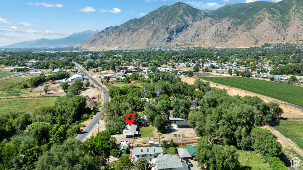 Aerial view of property and surrounding area with mountains