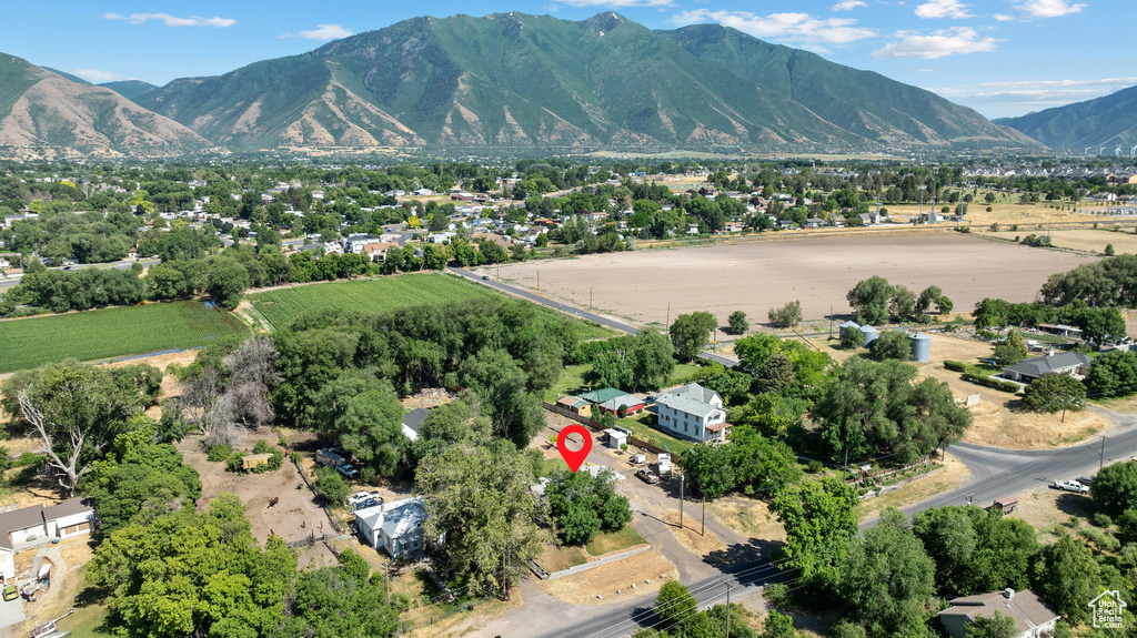 Aerial overview of property\'s location featuring a mountainous background