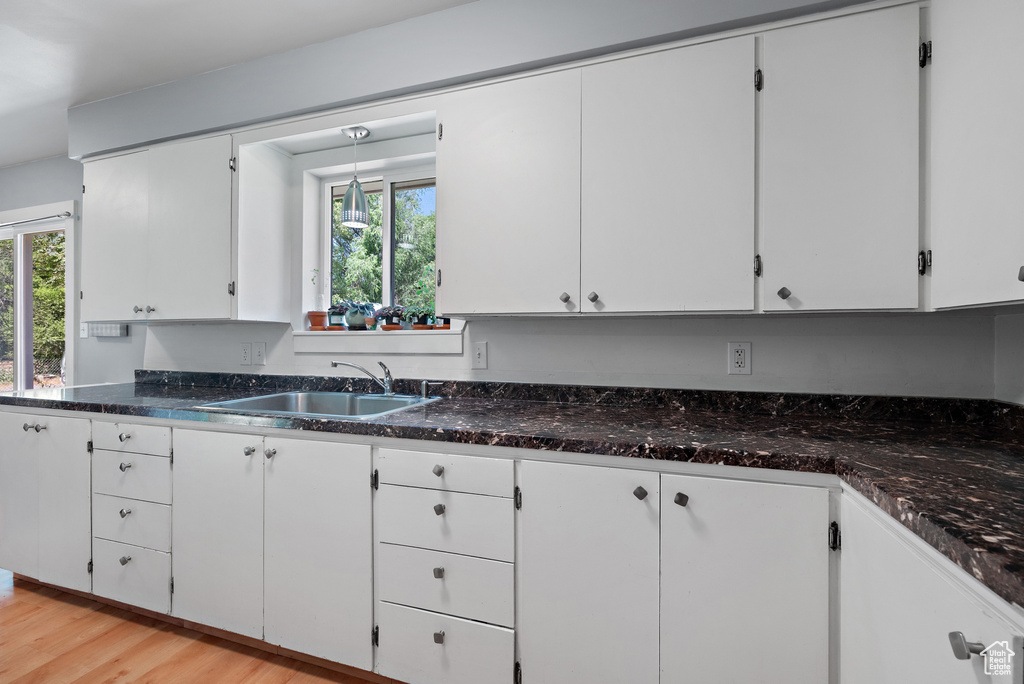 Kitchen with plenty of natural light and white cabinets