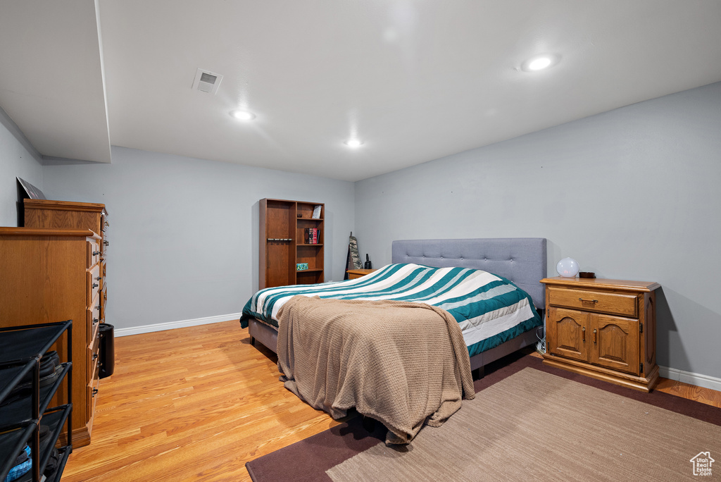 Bedroom featuring light wood-type flooring and recessed lighting