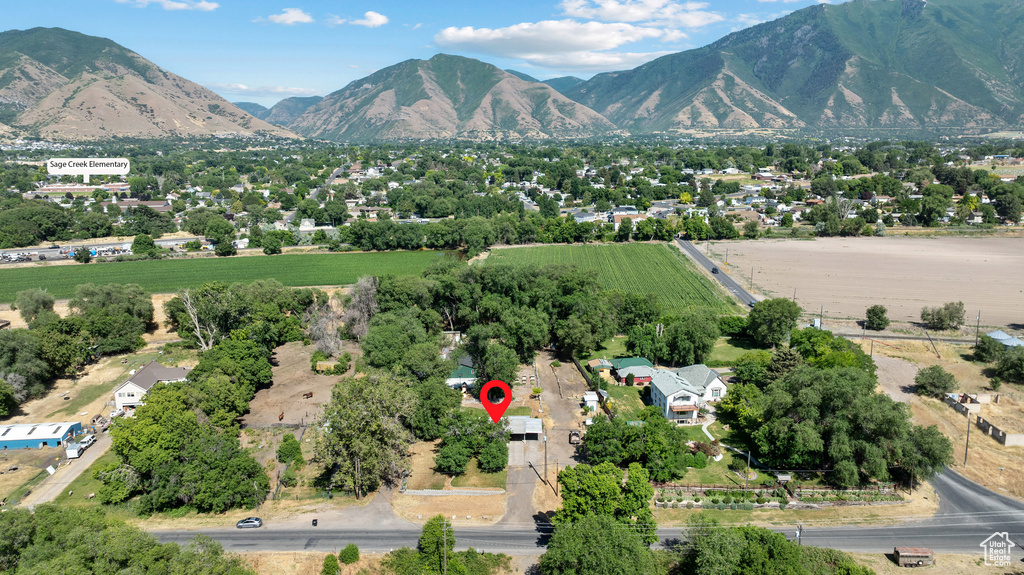 Aerial view of sparsely populated area featuring a mountainous background