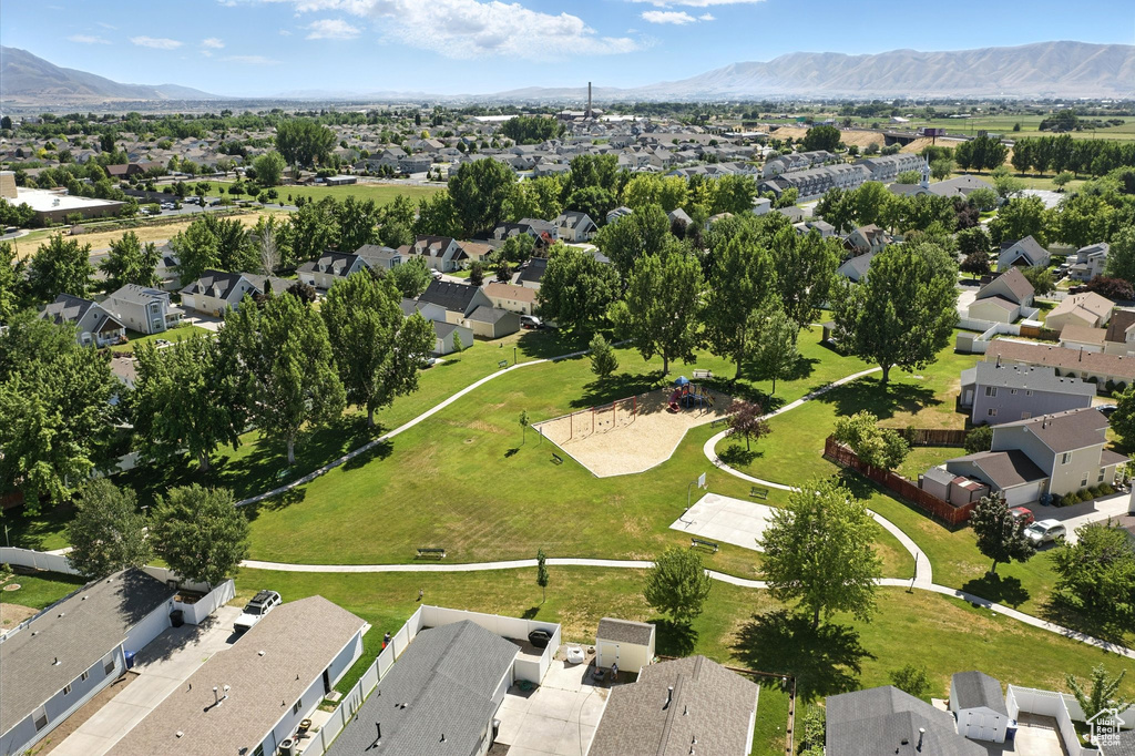 Aerial perspective of suburban area featuring a mountain backdrop