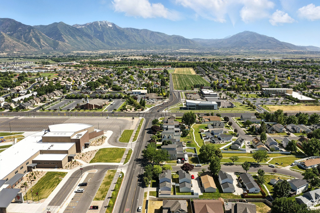 Aerial view of residential area featuring a mountainous background