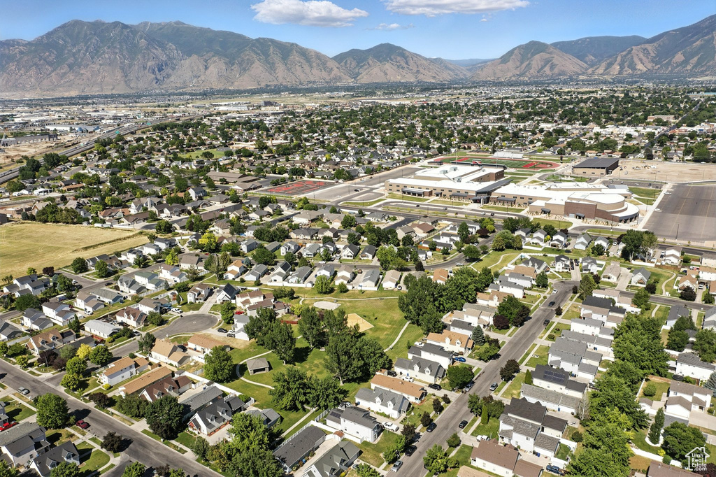Aerial view of property's location featuring nearby suburban area