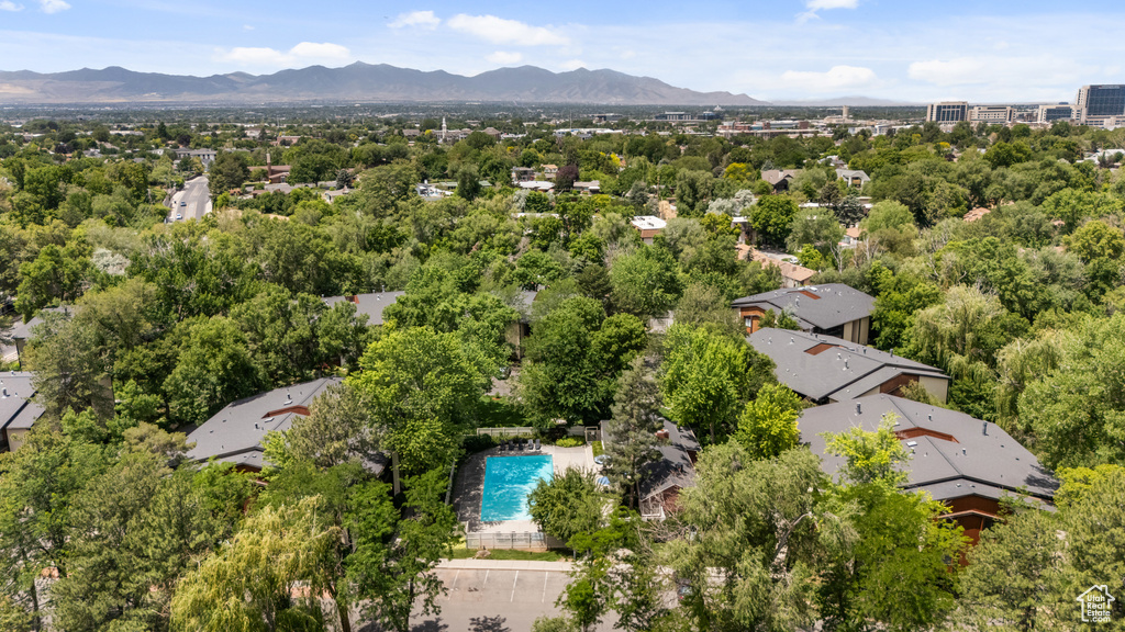 Bird's eye view of a pool area and a mountain backdrop