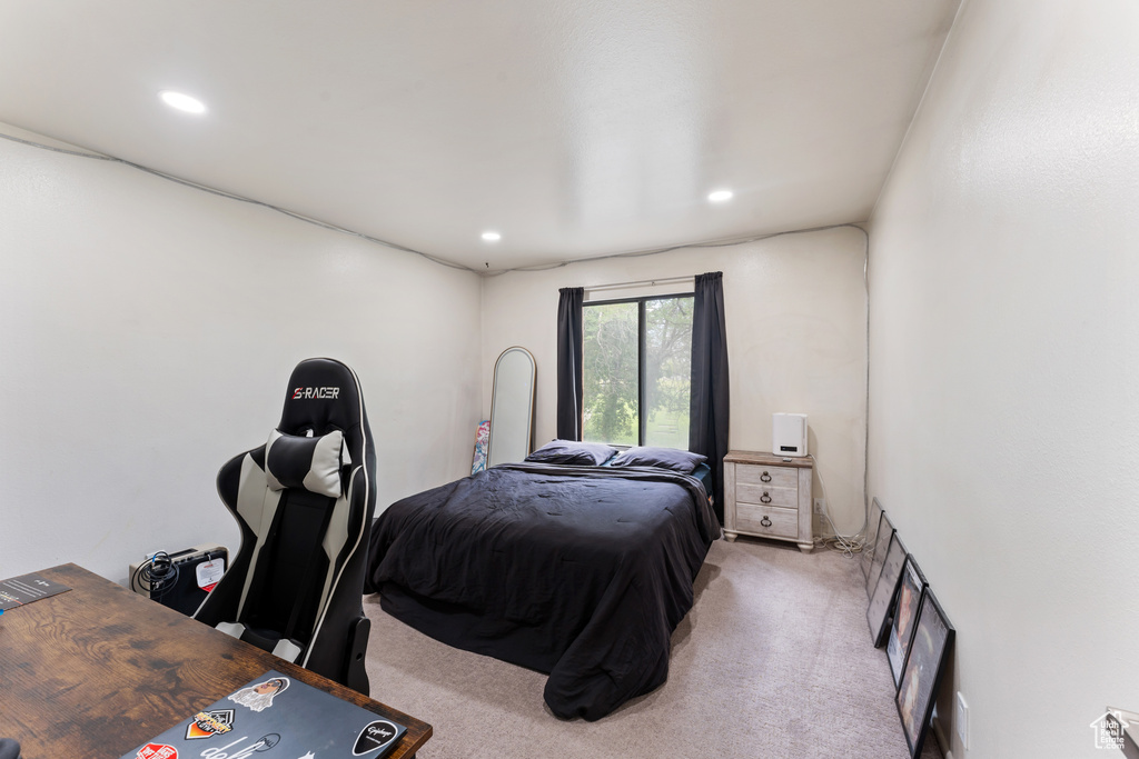 Bedroom featuring light carpet and recessed lighting