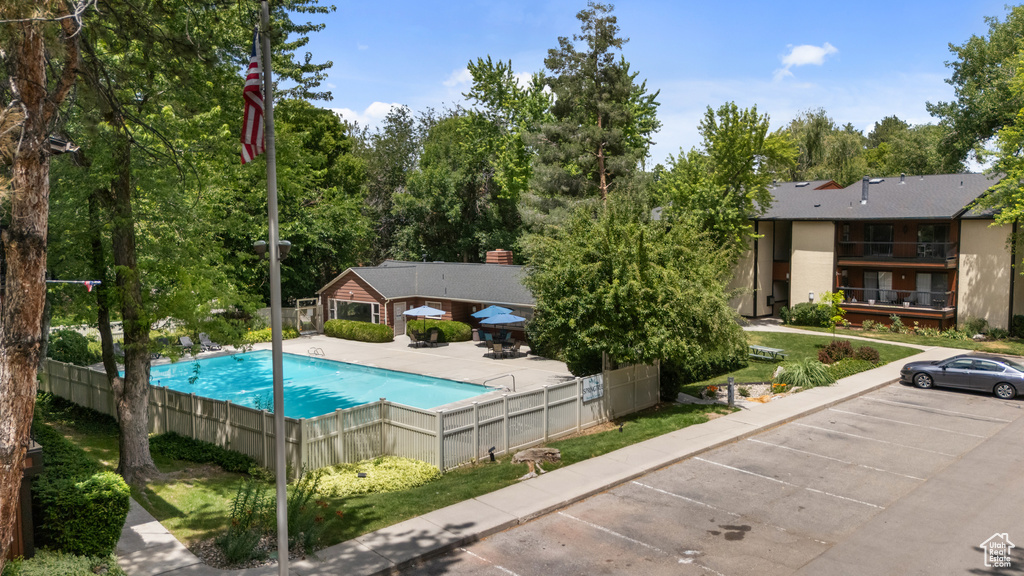 View of pool featuring view of scattered trees