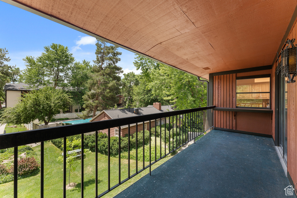 Balcony with view of wooded area