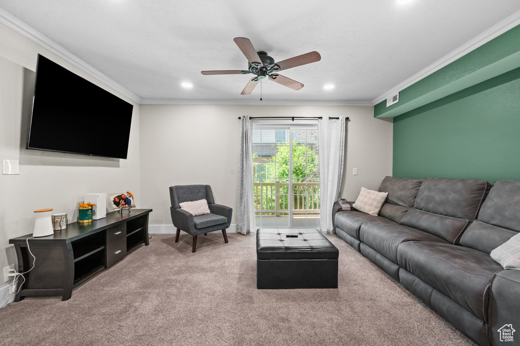 Living room with ornamental molding, carpet flooring, ceiling fan, and recessed lighting