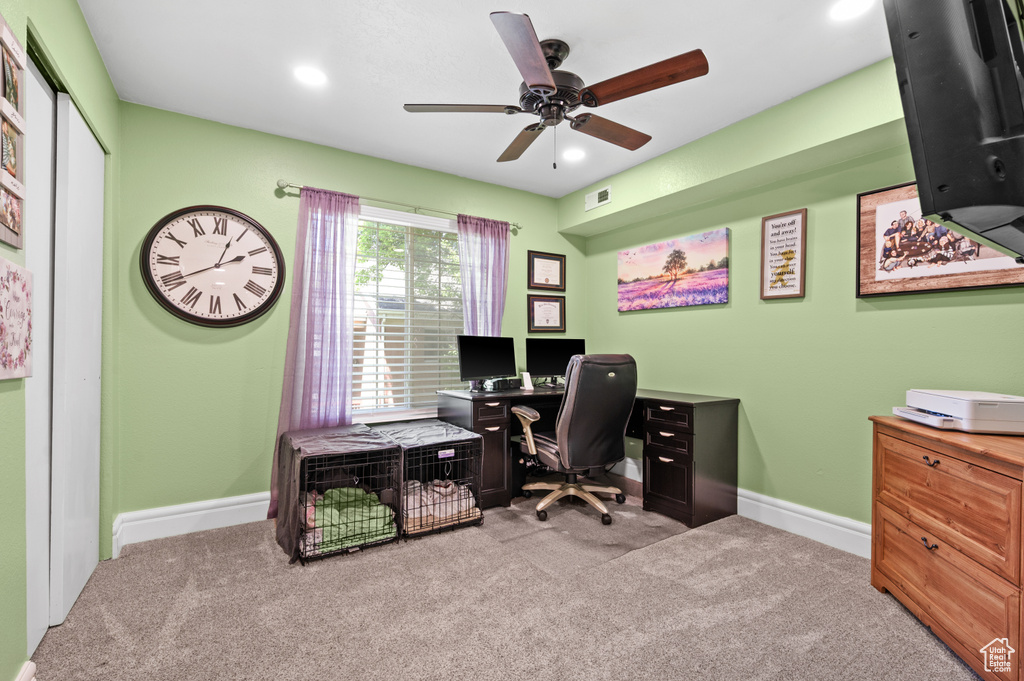 Office space with carpet flooring, a ceiling fan, and recessed lighting