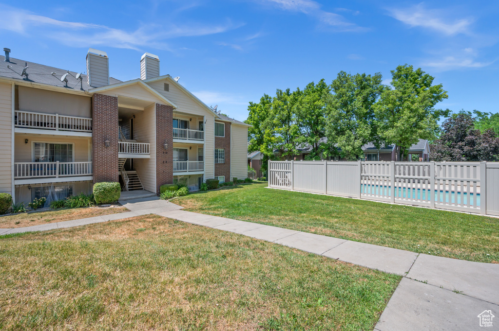 View of property\\\'s community featuring a pool