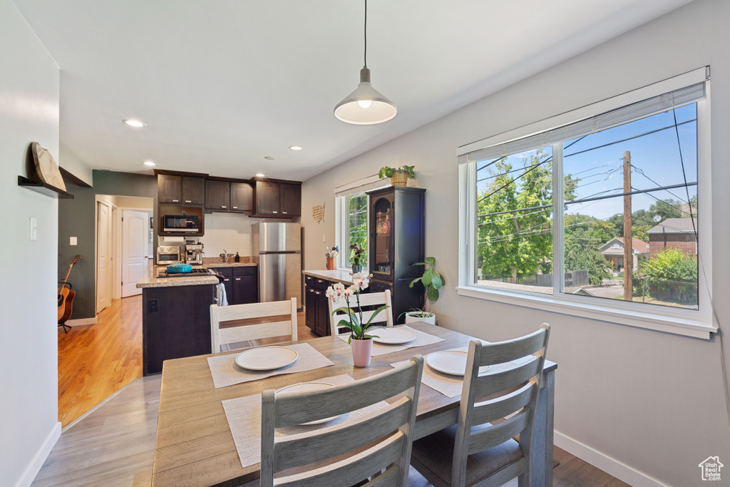 Dining area featuring recessed lighting and light wood-style floors