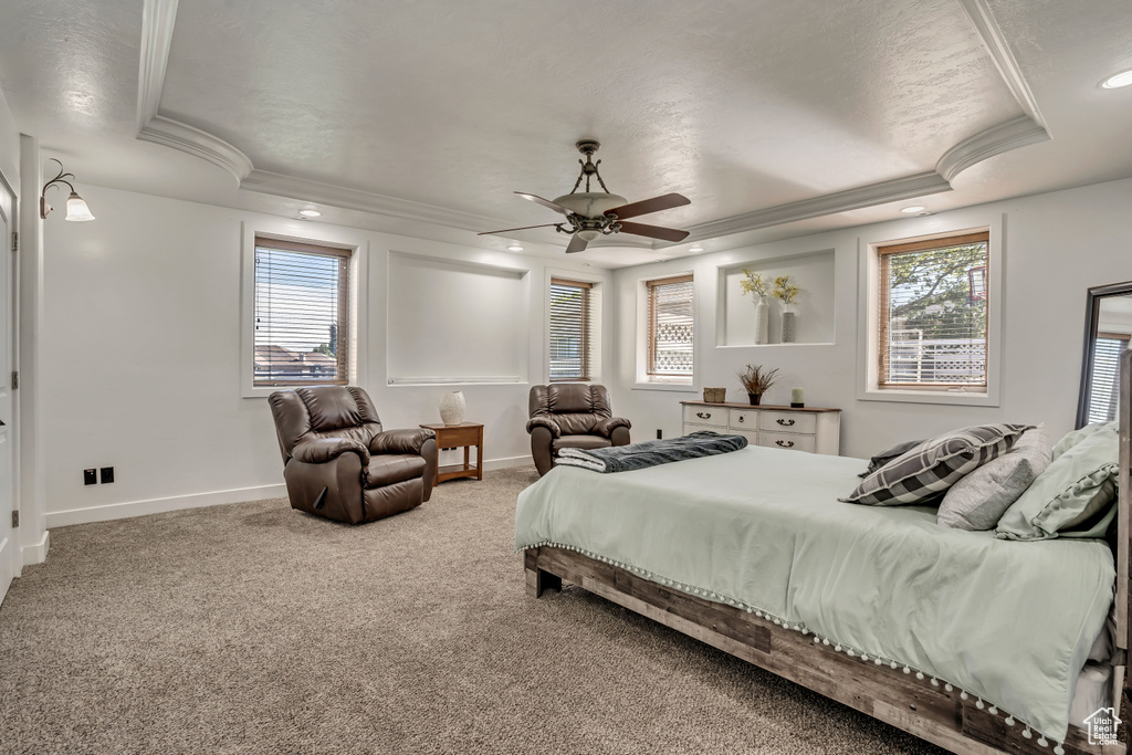 Bedroom with ornamental molding, a raised ceiling, carpet flooring, recessed lighting, and ceiling fan
