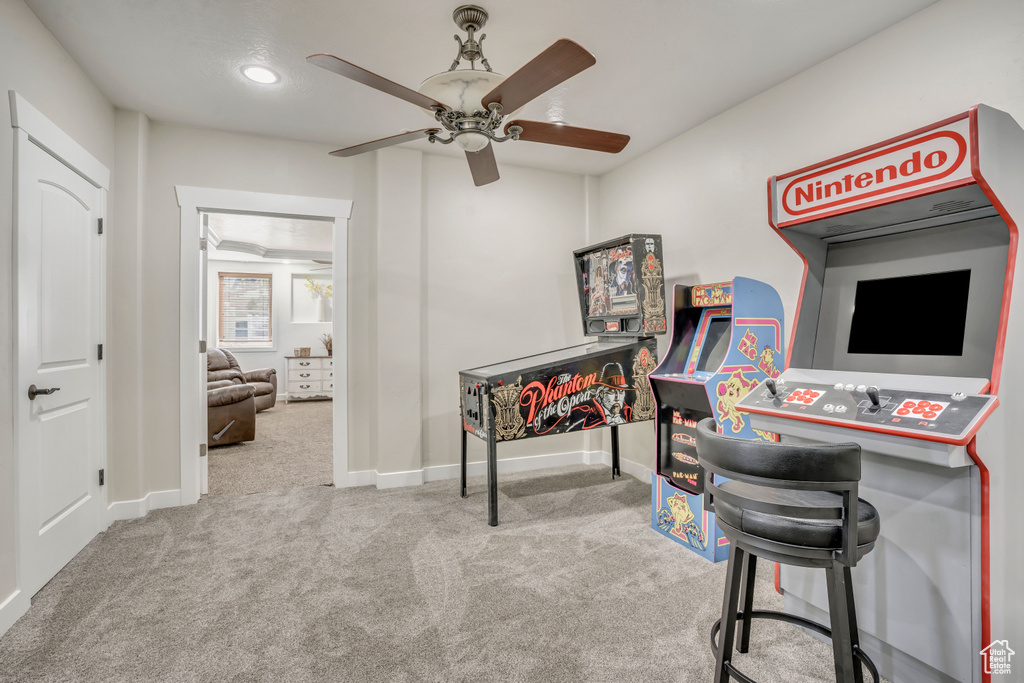 Carpeted home office featuring a ceiling fan and recessed lighting