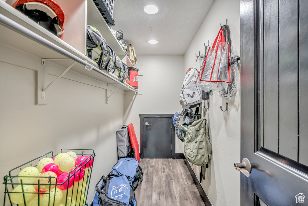 Spacious closet with wood finished floors