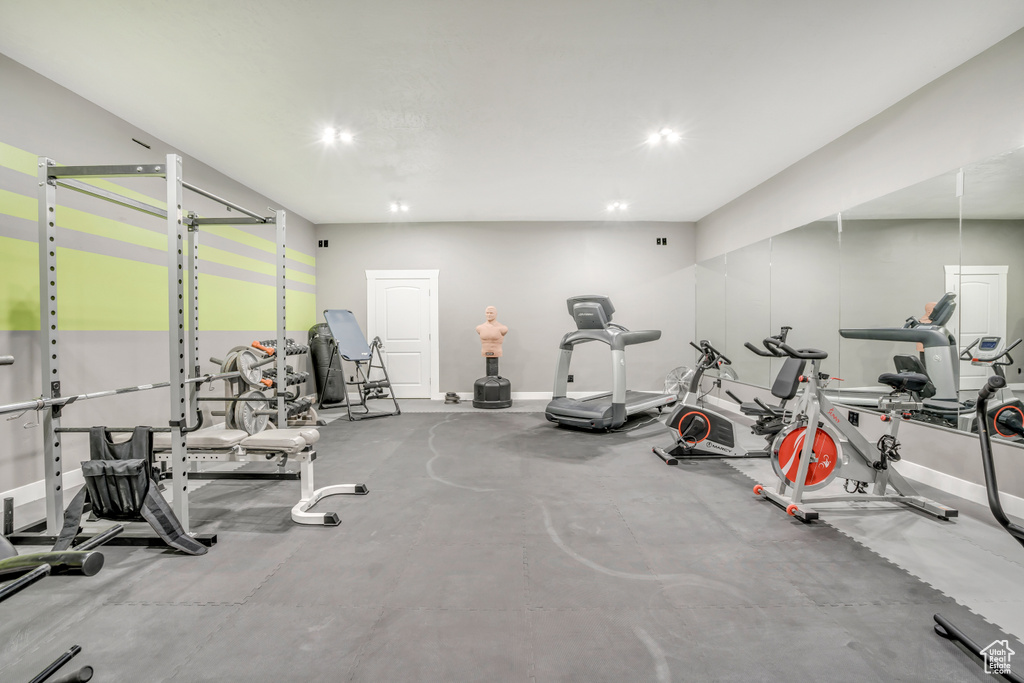 Workout area featuring baseboards