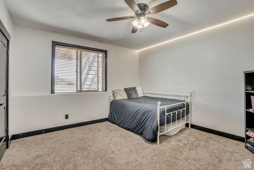 Bedroom featuring carpet floors and a ceiling fan