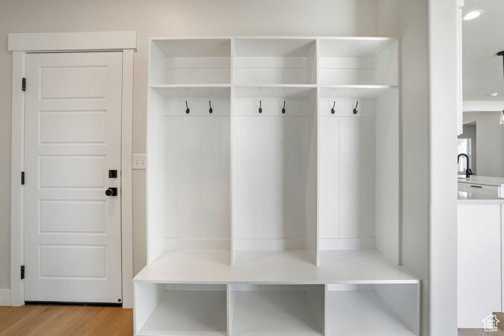 Mudroom with light wood-style floors