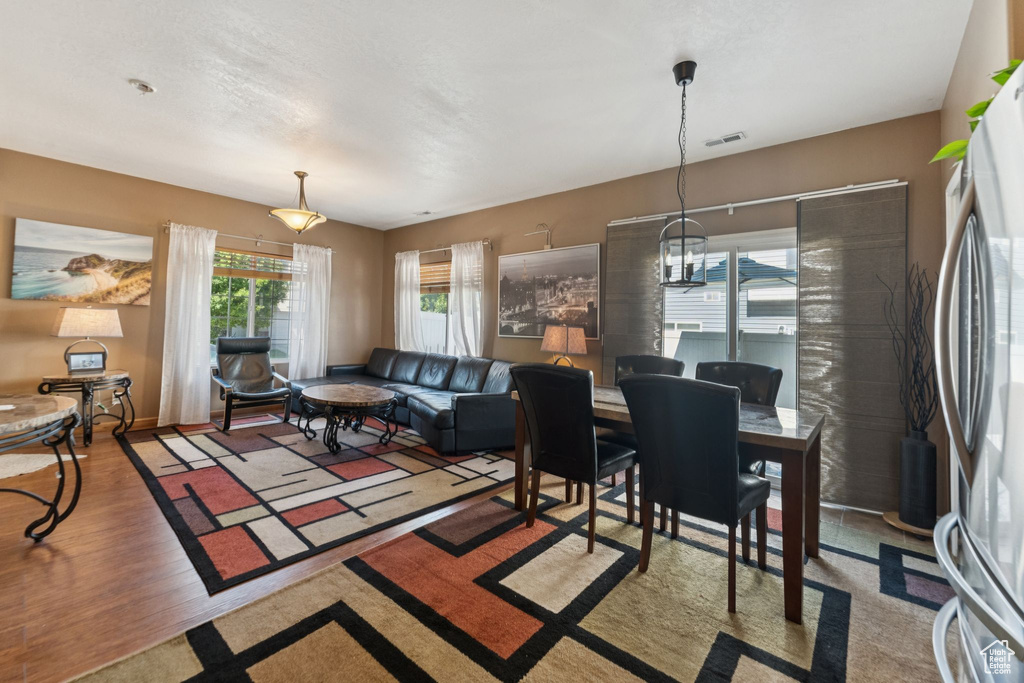 Dining space with wood finished floors and baseboards