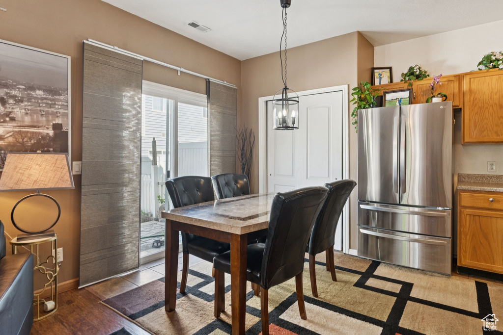 Dining space featuring wood finished floors