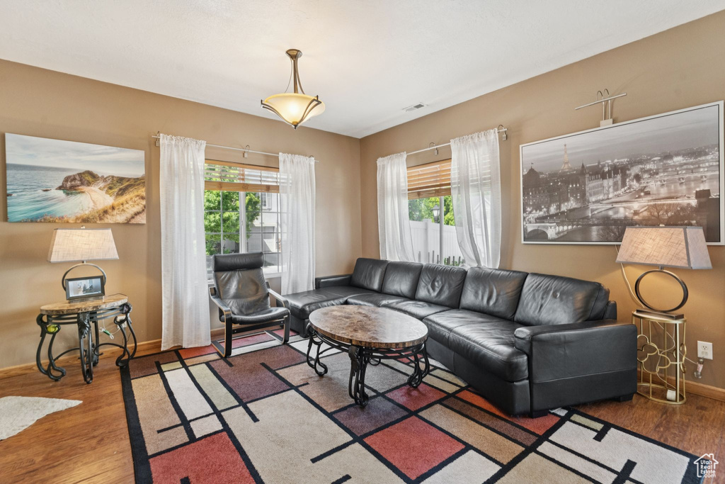Living room featuring wood finished floors and baseboards