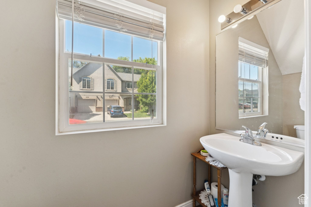 Bathroom with baseboards and toilet