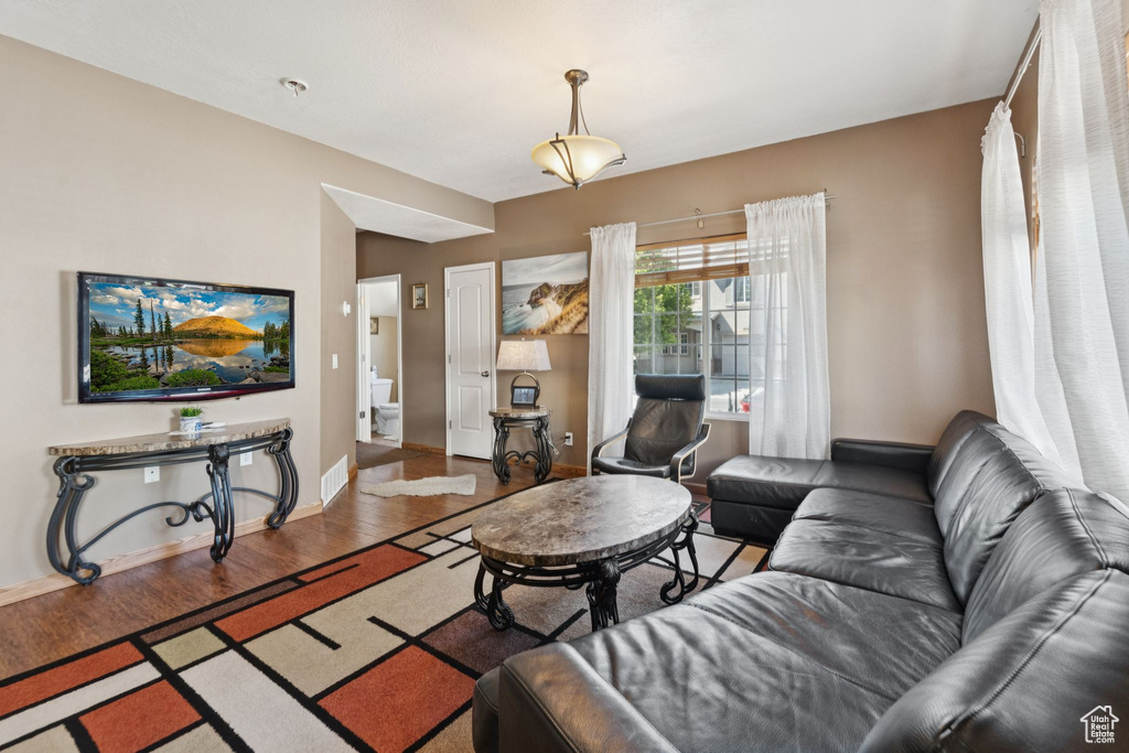Living room featuring wood finished floors and baseboards