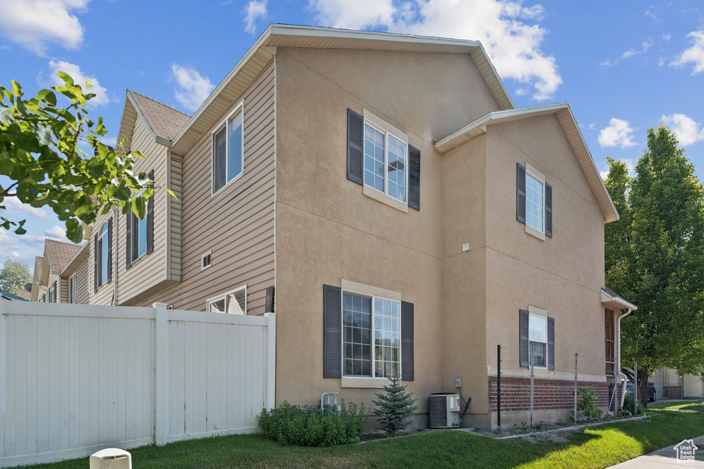 View of side of property with stucco siding