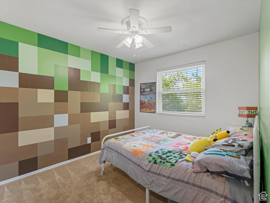 Bedroom featuring carpet flooring and a ceiling fan
