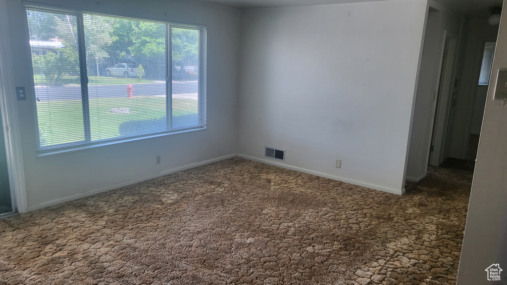 Unfurnished room featuring carpet floors
