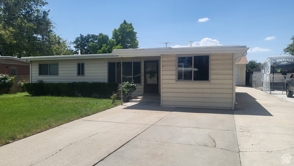 View of front facade with concrete driveway