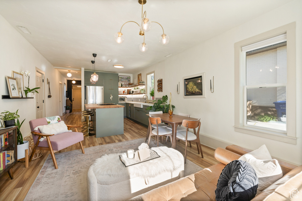 Living area featuring light wood-style flooring and plenty of natural light