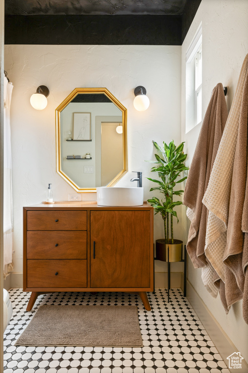 Bathroom featuring vanity and tile patterned floors