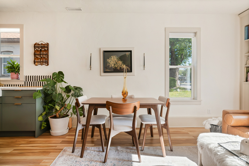 Dining space featuring light wood-type flooring