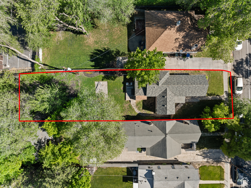 Aerial view of property and surrounding area with property parcel outlined