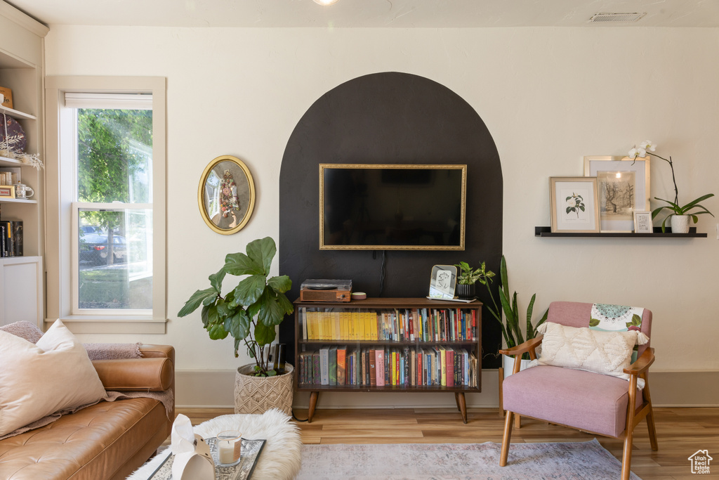 Sitting room featuring wood finished floors