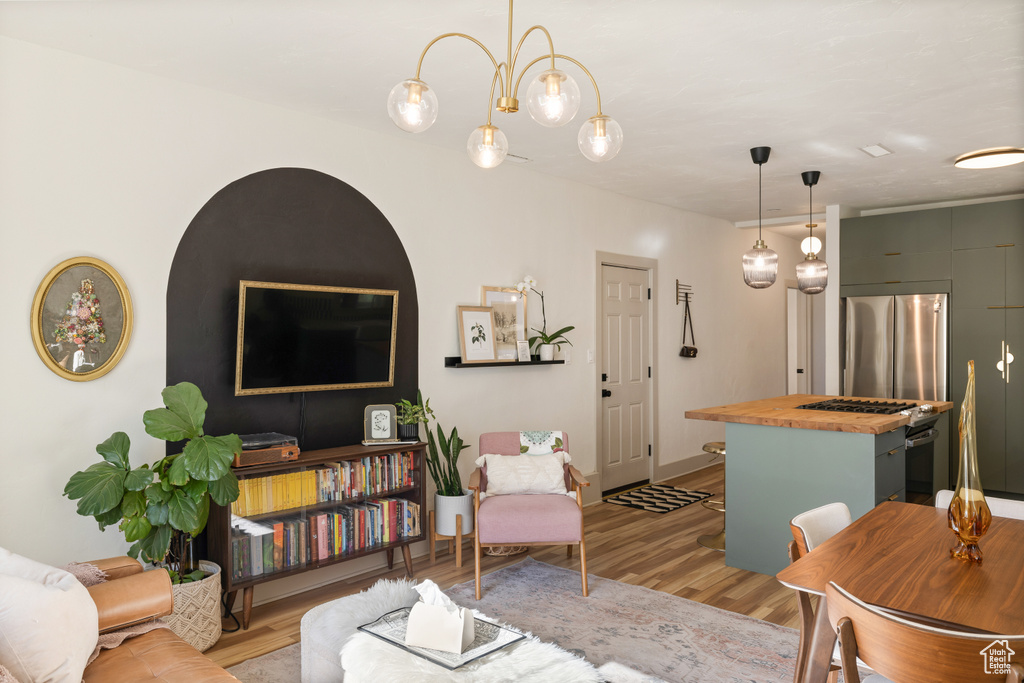 Living area featuring light wood-style flooring and baseboards