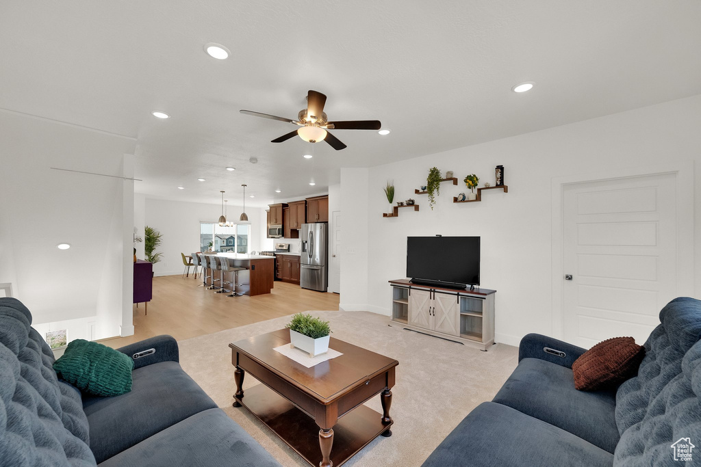 Living area featuring recessed lighting, a ceiling fan, and light wood-type flooring