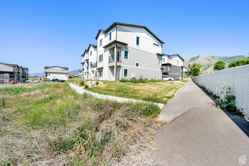 View of property exterior with a mountain view
